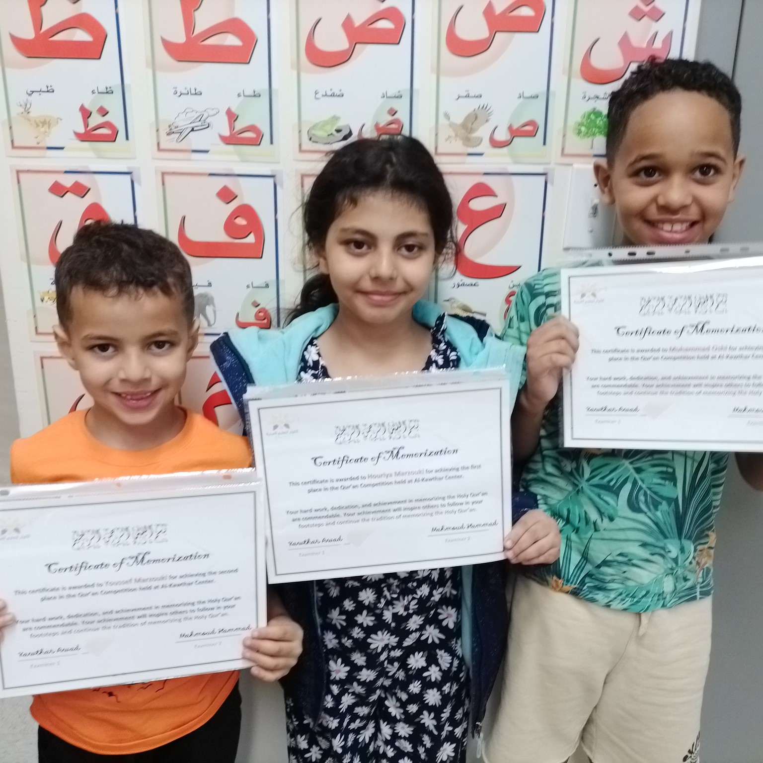 Picture of students holding certificate